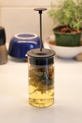 Linden blossom tea; Close-up of linden blossom brewed in a transparent vessel