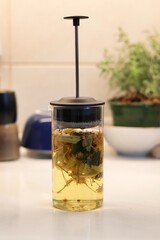 Linden blossom tea; Close-up of linden blossom brewed in a transparent vessel