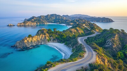 Serpentine coastal road winds through turquoise bay