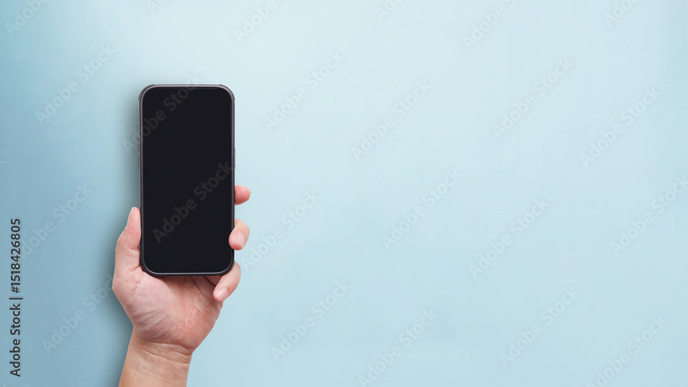 Poster man hand holding phone in black empty screen for mobile app mockup in blue pastel color background i