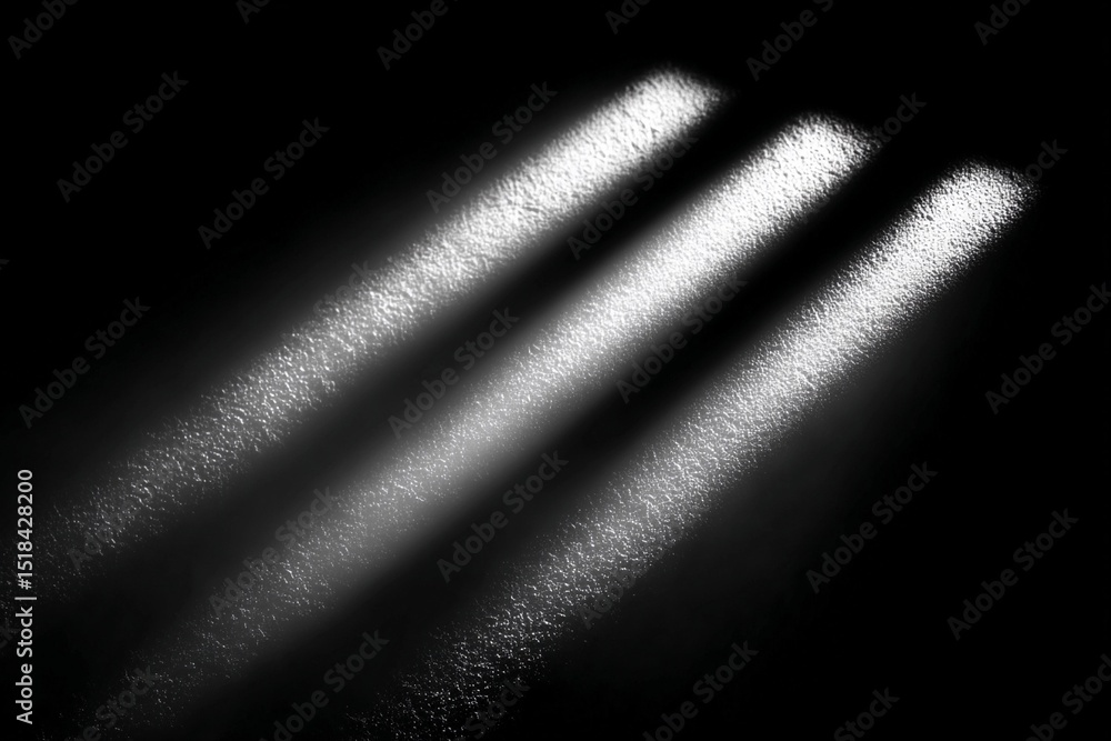 Poster light beams create striking patterns in darkness capturing visual intrigue
