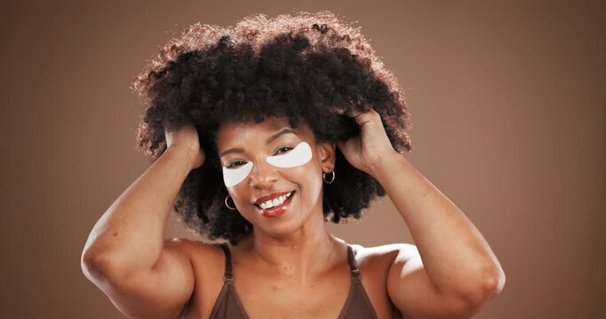 Studio, woman face and beauty with eye mask for skincare, facial treatment and collagen with smile. Afro, African person and portrait with patches for cosmetics, confidence and space in background