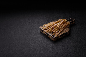 Food, snacks or jerky made from dried dehydrated salted fish with spices. Snacks fish