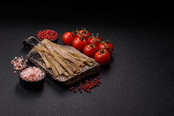 Food, snacks or jerky made from dried dehydrated salted fish with spices. Snacks fish