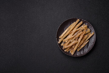 Food, snacks or jerky made from dried dehydrated salted fish with spices. Snacks fish