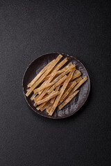 Food, snacks or jerky made from dried dehydrated salted fish with spices. Snacks fish
