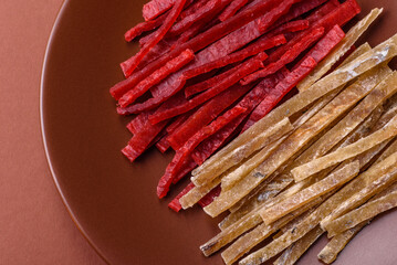 A set of jerky or snacks of chicken and fish with salt and spices