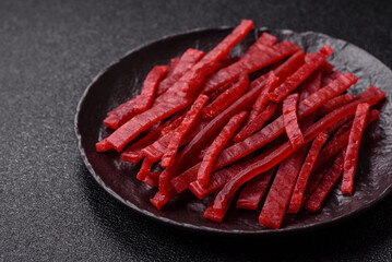 Jerky or dried chicken and cherry snacks. Dehydrated, dried snacks for beer