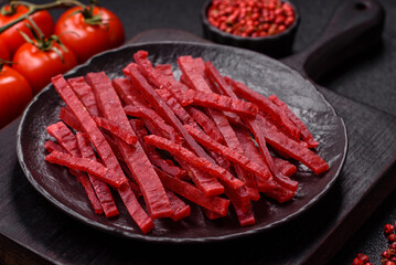 Jerky or dried chicken and cherry snacks. Dehydrated, dried snacks for beer