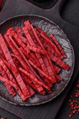 Jerky or dried chicken and cherry snacks. Dehydrated, dried snacks for beer