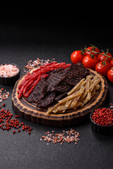 A set of jerky or snacks of beef, chicken and fish with salt and spices