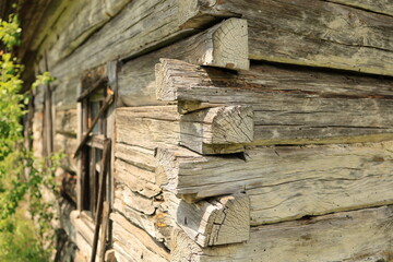 A close-up of the wall junction of an old abandoned wooden house in Ukrainian Polissia, Chernihiv region.