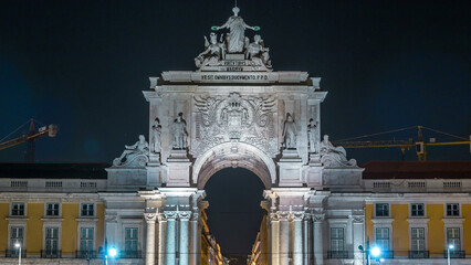 Triumphal arch at Rua Augusta at Commerce square night timelapse in Lisbon, Portugal.