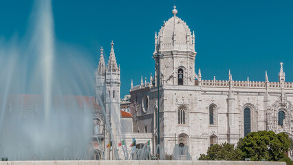Obraz premium Jeronimos monastery and fountain seen from the Imperio garden timelapse in Lisbon, Portugal.