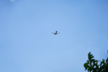 Passenger Plane Taking Off Against Blue Sky and Clouds