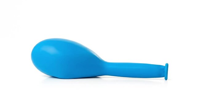 Blue rubber balloon sitting on a plain white background  