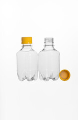 Two plastic bottles with a yellow cap