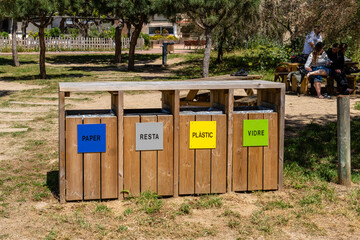 renys de Mar, Spain-June 03, 2025. Outdoor Recycling Bins in Park Setting