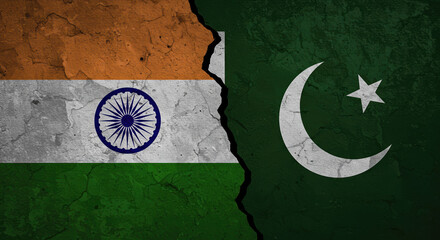 Split image of India and Pakistan flags on cracked wall background  