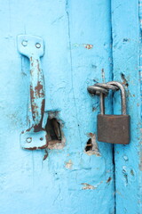 old lock on a vintage blue door