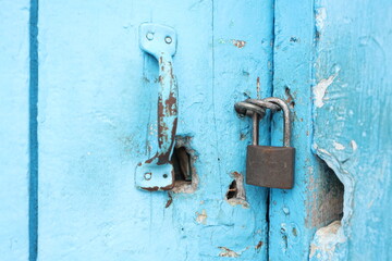 old lock on a blue wooden door