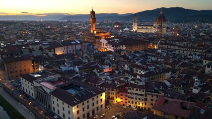 night aerial view of Florence with Florence cathedral and Ponte Vecchio, Italian Renaissance architecture, iconic drone shot of Florence