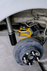 Yellow springs for cars.Upgrade your car's springs to be more efficient.Install new springs and shocks into the vehicle.Install springs and shocks on the back of the vehicle.