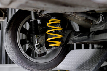 Yellow springs for cars.Upgrade your car's springs to be more efficient.Install new springs and shocks into the vehicle.Install springs and shocks on the back of the vehicle.