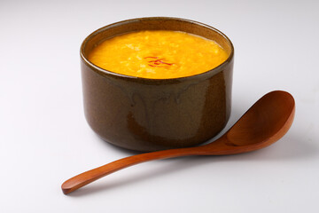 Indian Food - Aamras is a sweet dish made from the pulp of the Alphonso mango fruit. Served in a traditional ceramic bowl
