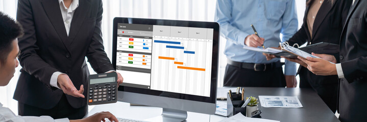 Project planning software for brisk business project management on the computer screen showing...