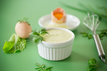 Green background and products for making fresh mayonnaise