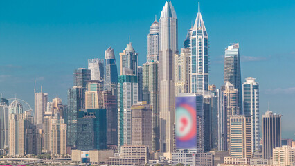 Obraz premium Dubai Marina skyscrapers and golf course morning timelapse, Dubai, United Arab Emirates