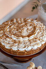A Beautifully Deliciously Decorated Layered Cake with Cream, Caramel, and Artistic Flair