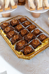 Deliciously beautiful Brownies topped with Caramel Swirls elegantly displayed on a Festive Table