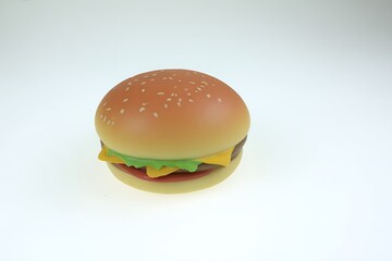 Burger plastic toy on white background