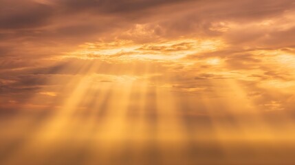 Golden celestial rays pierce through the clouds