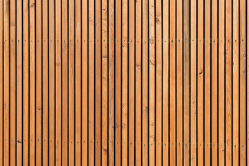 English: Vertical wooden planks create a rhythmic pattern, emphasizing natural texture and symmetry, perfect for modern architectural backgrounds.