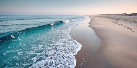 Ocean Surf on Quiet Sandy Beach at Sunrise