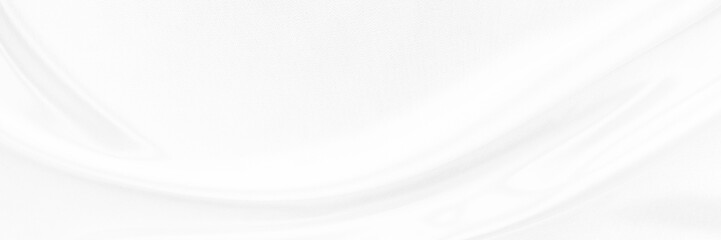 White gray satin texture that is white silver fabric silk panorama background with beautiful soft blur pattern natural.