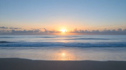 Serene sunrise over ocean beach waves