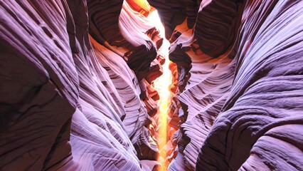 Soft sunlight filtering through narrow Antelope Canyon passageways, revealing sculptural sandstone walls glowing with warm orange and deep purple hues