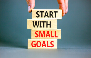 Start with small goals symbol. Concept words phrase Start with small goals on beautiful wooden...