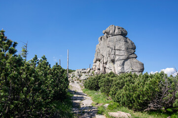 Granite rock in poland part of Giant mountains Krkonose called Słonecznik, sunny summer touristic season with blue sky