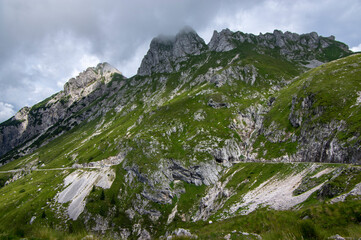 Mala Spice Cime Verdi peaks view from Mangart saddle, Slovenia's Highest Panoramic Road, heavy clouds before rain