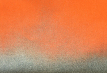 silver color spray paint gradient on orange color paper