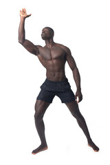 Obraz premium front view of a man wearing shorts pushing something imaginary upwards with one hand.