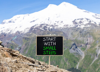 Start with small steps symbol. Concept words phrase Start with small steps on beautiful black...