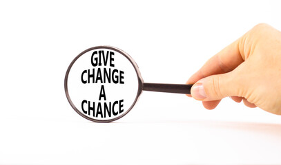 Give change a chance symbol. Concept words phrase Give change a chance in beautiful magnifying...