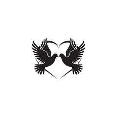 Two Doves in Flight Encircling a Heart Symbol.This simple, elegant graphic depicts two doves in flight, their wings outstretched, encircling a heart shape.