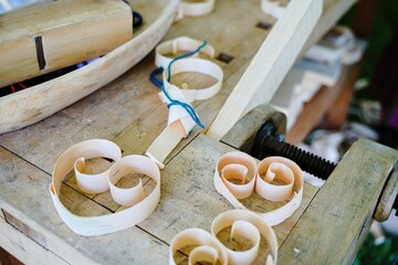       Wood shavings on the craftsman's workbench. Handicraft and shavings in the workshop....